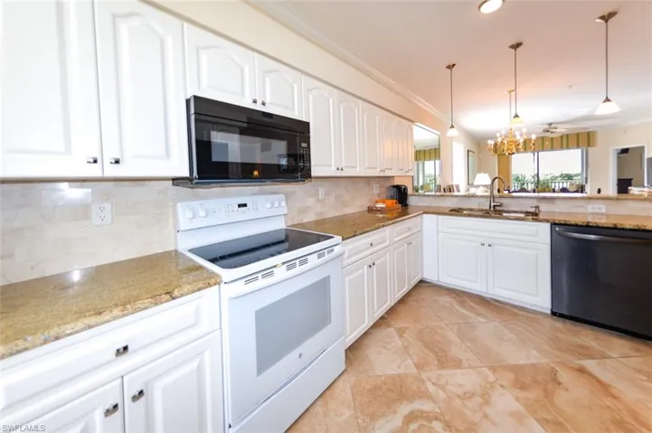 Kitchen featuring sink, dishwasher, white range with electric cooktop, and ornamental molding