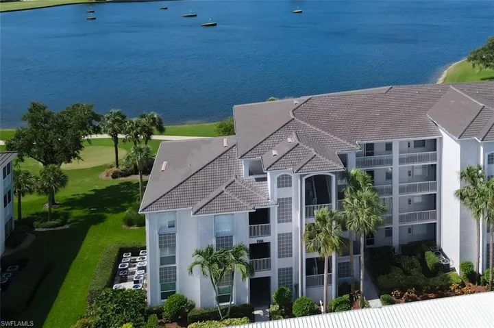Birds eye view of property featuring a water view