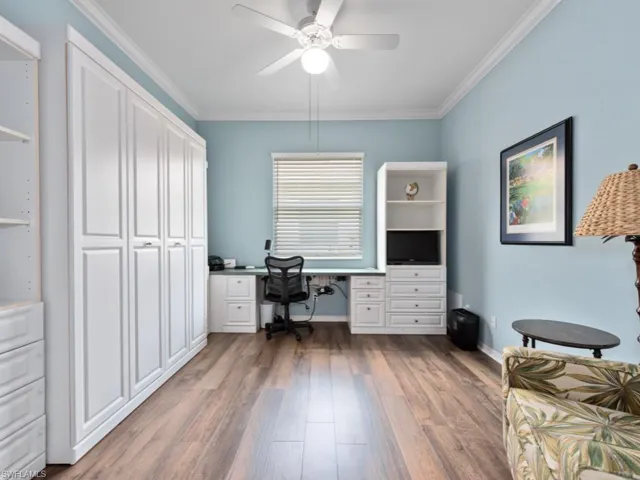 Office featuring ornamental molding, hardwood / wood-style flooring, and ceiling fan