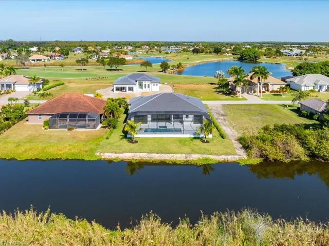 Aerial view of residential area featuring a large body of water