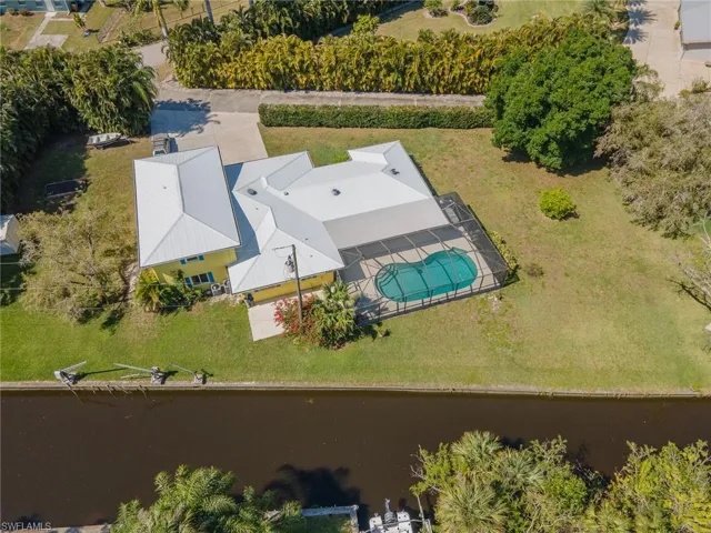 Bird's eye view of the new roof, huge homesite and canal.