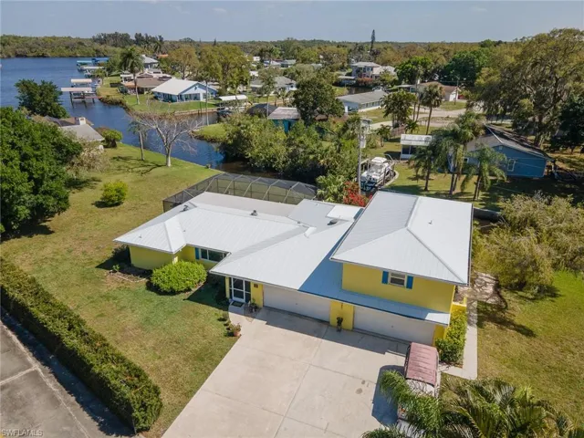 Birds eye view of property with a water view showing of the huge oversized yard with 200 ft of waterfront beauty.