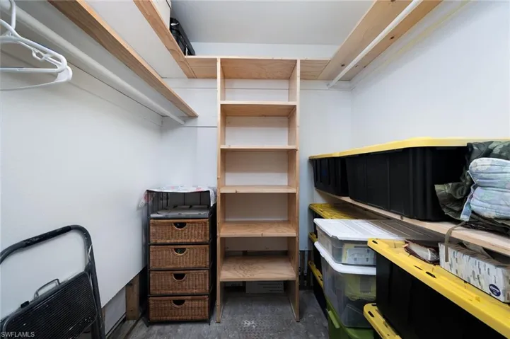 View of one of the walk in closets