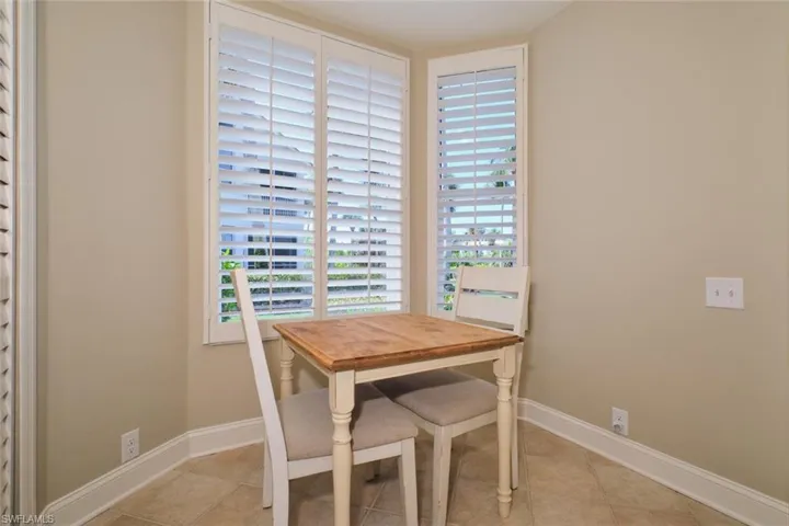 Dining area with baseboards and light tile patterned floors