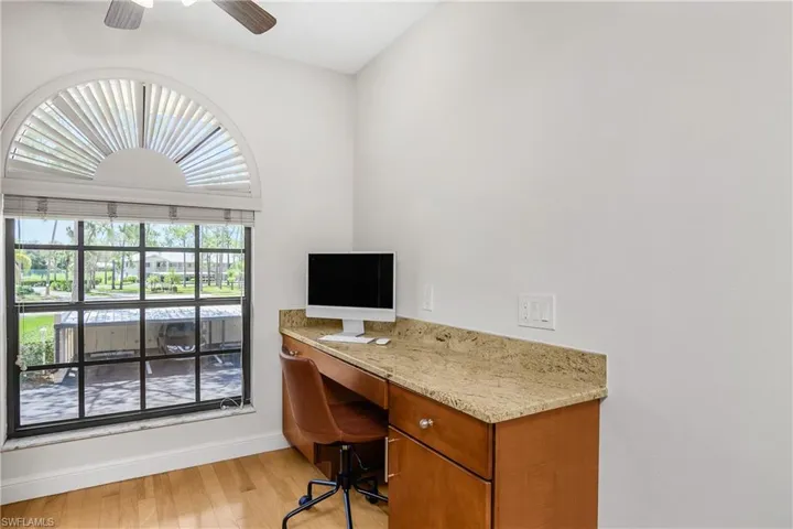 Home office featuring light wood-type flooring and ceiling fan