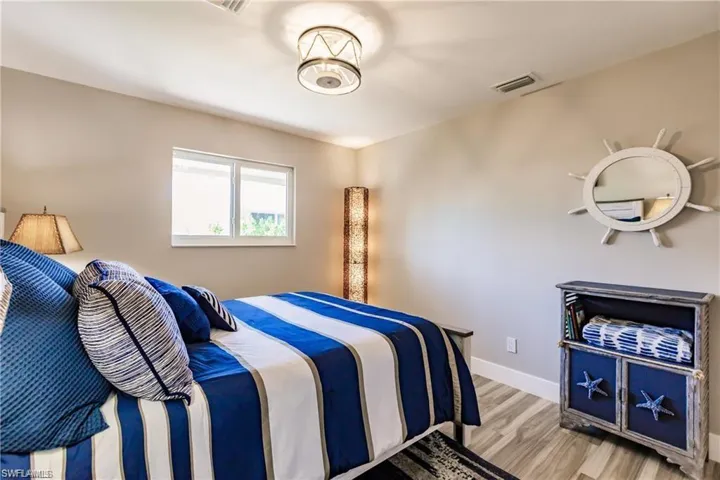 Guest bedroom, with recessed lighting, tile flooring