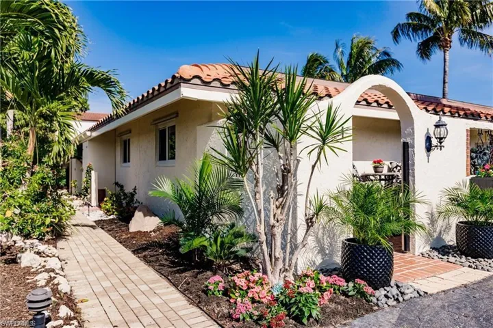 Front Exterior, corner unit with enclosed sunny courtyard patio.