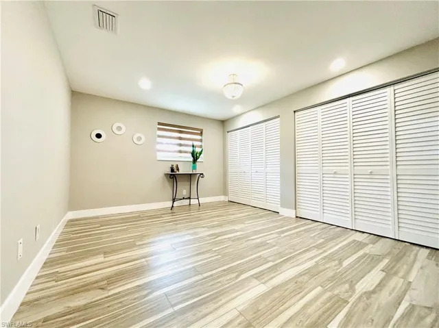 Primary bathroom offers wall-to-wall closet space