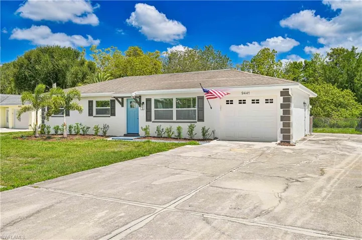 Ranch-style home featuring stucco siding, a garage, concrete driveway, and roof with shingles