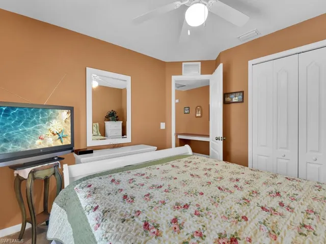 Bedroom featuring a closet and ceiling fan