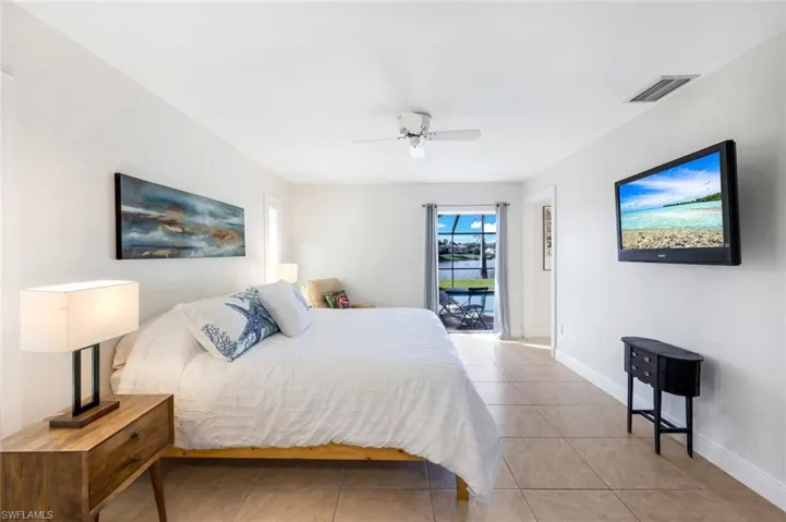 Access the lanai/pool from your primary bedroom suite.