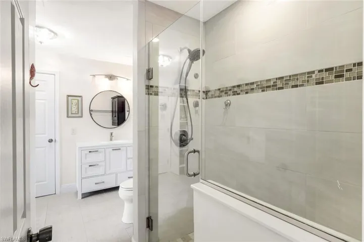 Primary bathroom features a walk-in shower.