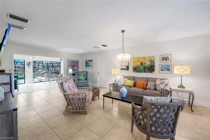Open great room is offers views of the pool and lake!
