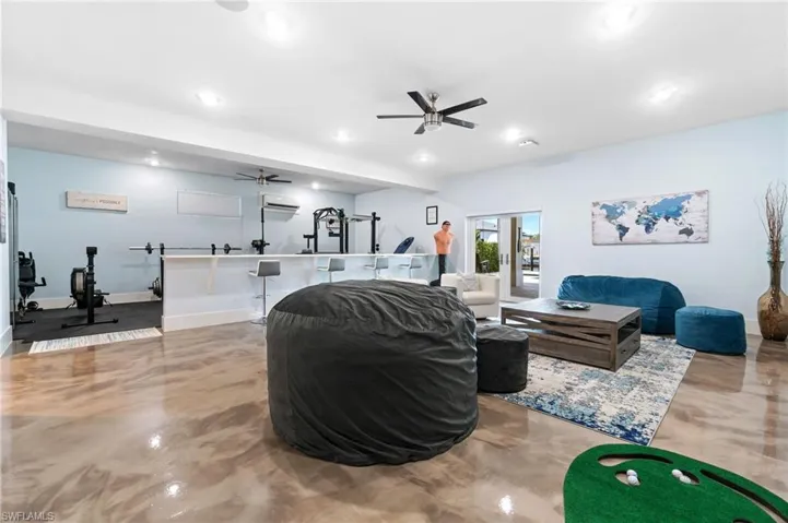 Downstairs living room with metallic epoxy floors and splitter A/C