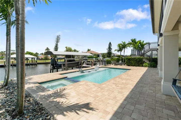 View of pool, spa, dock, lifts and water view!