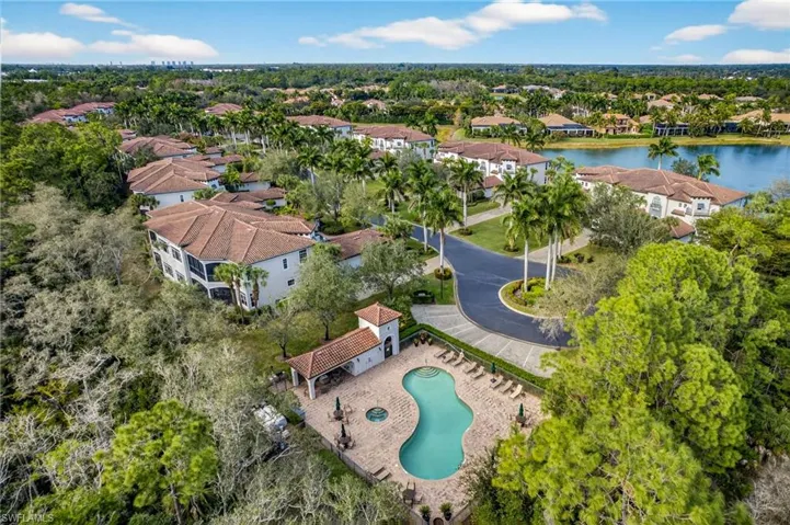 Aerial view of residential area featuring a large body of water