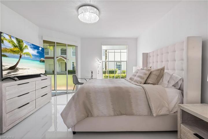 Master bedroom wing has access to your lanai. Beautiful custom lighting.
