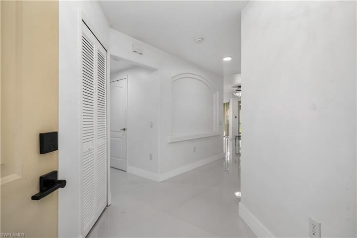 View coming into your condo in the foyer area.