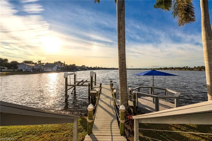 Dock with boat lift and a water view