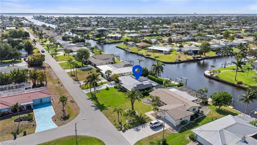 Bird's eye view featuring a residential view and a water view  - Virtually Edited Image