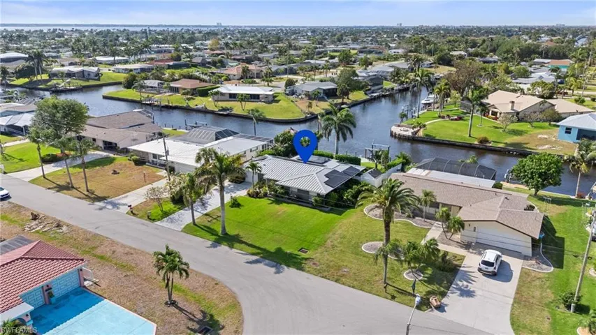 Birds eye view of property with a residential view and a water view  - Virtually Edited Image