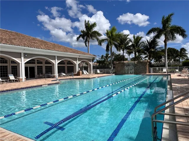 Community pool featuring a patio
