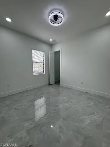 Mother-in-low's room, Spare room featuring recessed lighting and light marble finish floors, Bedroom - Bathroom - Kitchenette - Laundry inside and Walking Closet.