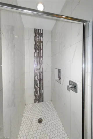 Full bath featuring a stall shower