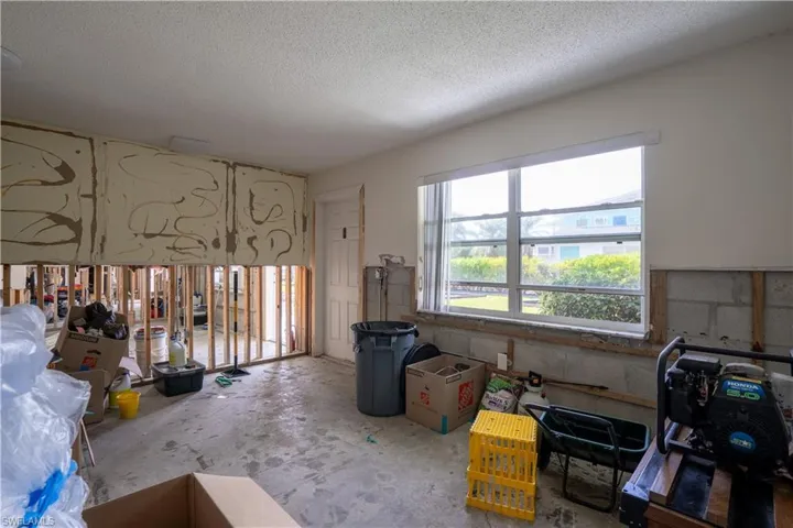 Miscellaneous room featuring a textured ceiling
