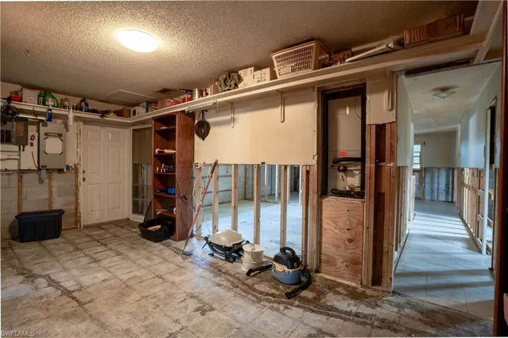 Basement with a textured ceiling and a wealth of natural light