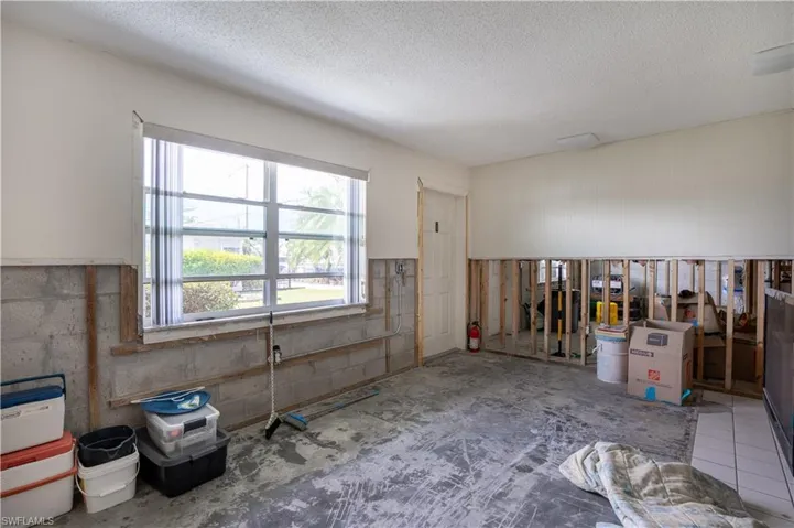 Miscellaneous room with a textured ceiling