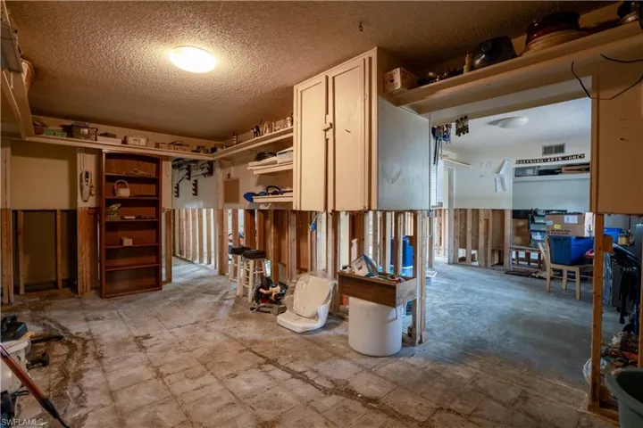 Misc room with a textured ceiling
