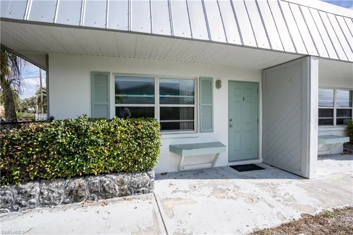 Property entrance featuring a patio area