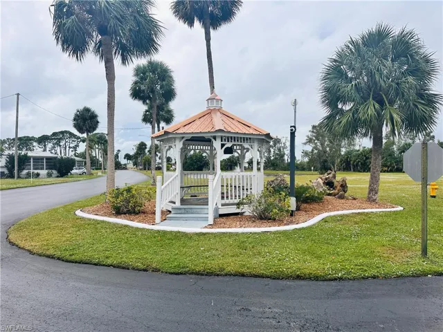 View of home's community featuring a gazebo and a yard