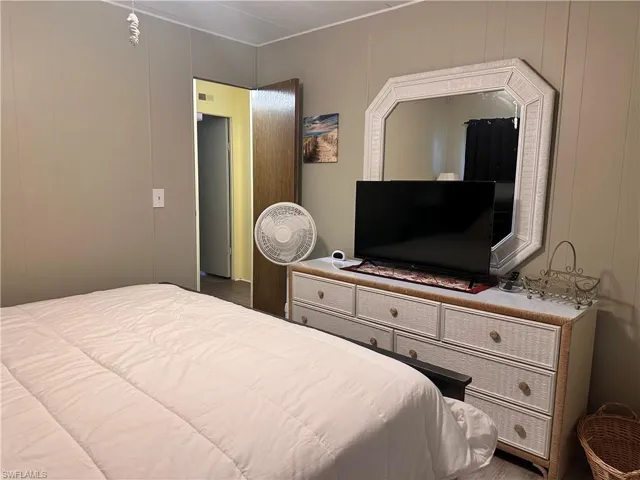 Bedroom featuring dark hardwood / wood-style floors