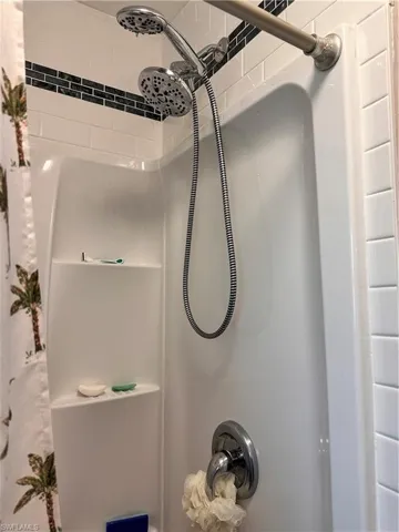 Interior details featuring curtained shower