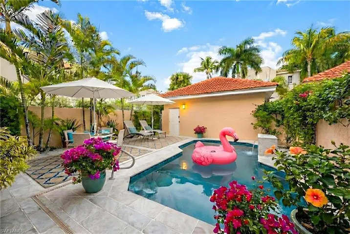 View of pool with a fenced backyard and patio surround