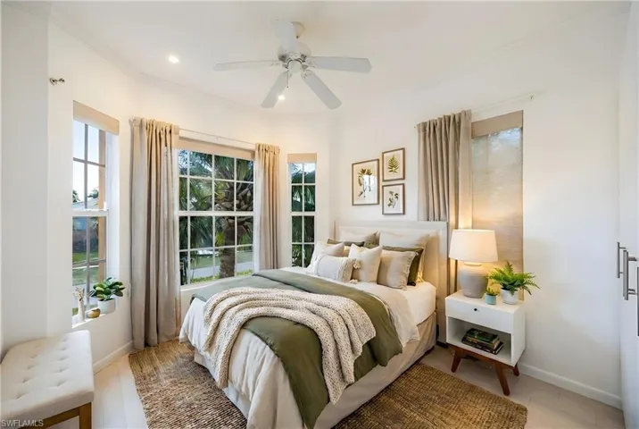Bedroom featuring crown molding, multiple windows, a ceiling fan, wood finished floors, and recessed lighting