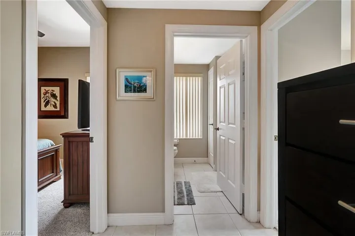 Hall with light tile patterned floors
