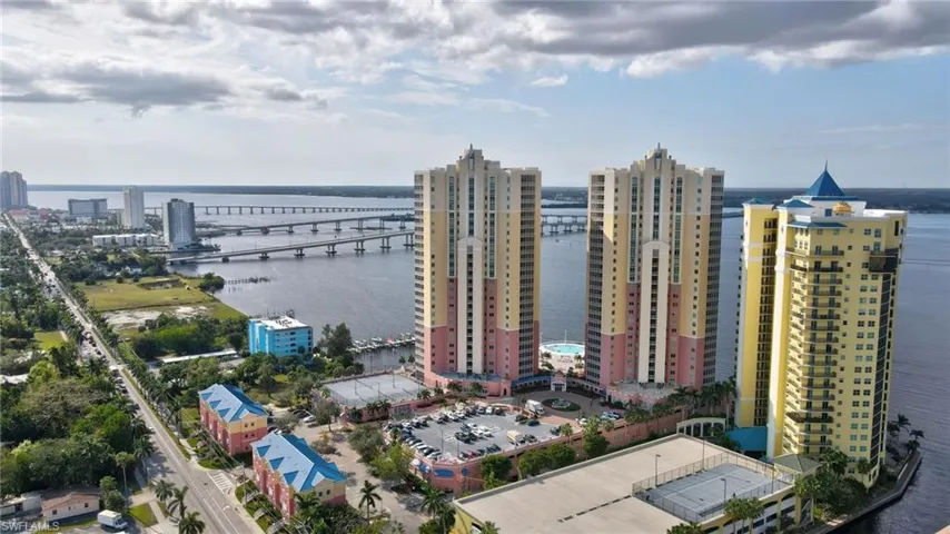 Birds eye view of property with a water view