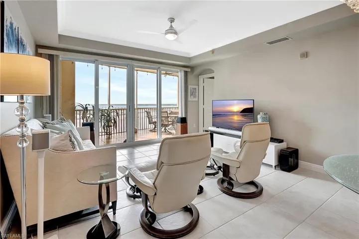 Tiled living room with ceiling fan