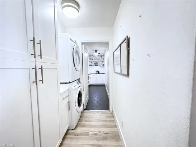 Laundry area that connects to walk-in pantry with ample storage and preparation space