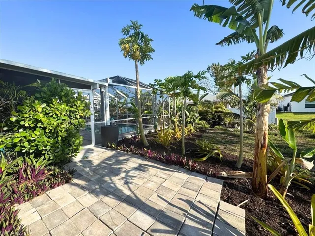 View of patio / terrace with a lanai and an inground pool