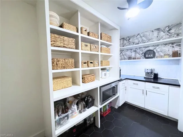 Walk-in pantry with additional butcher block countertop space
