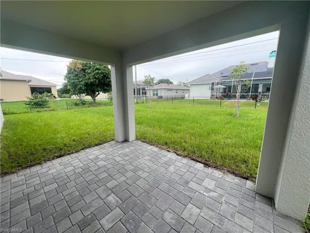Fenced backyard with a patio area