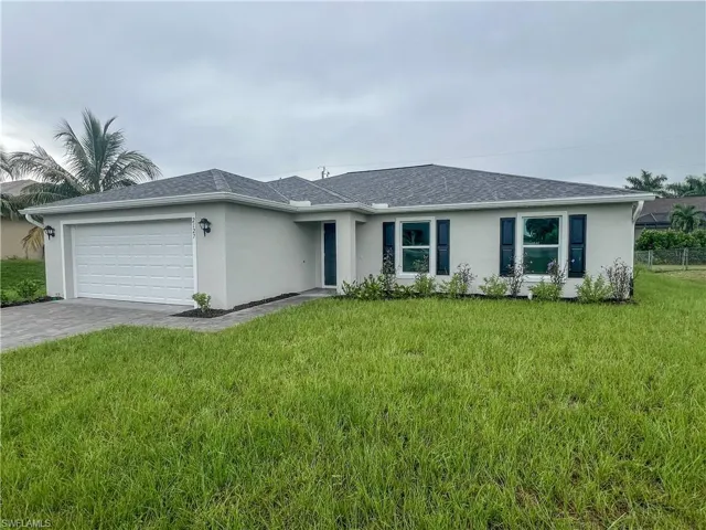 Ranch-style house with stucco siding, an attached garage, decorative driveway, a shingled roof, and a front lawn