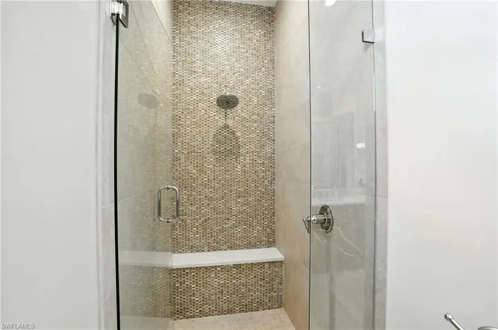 Full bathroom with a shower stall