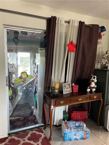 View of lanai door leading to enclosed lanai/porch
