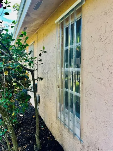 Exterior view of stucco siding/storm shutters