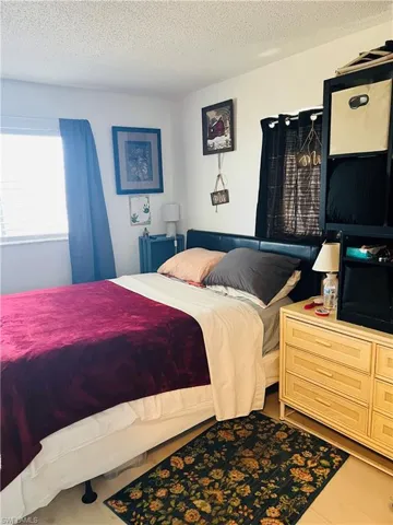 Bedroom with a textured ceiling